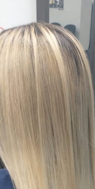 Sleek blonde silk press with shine